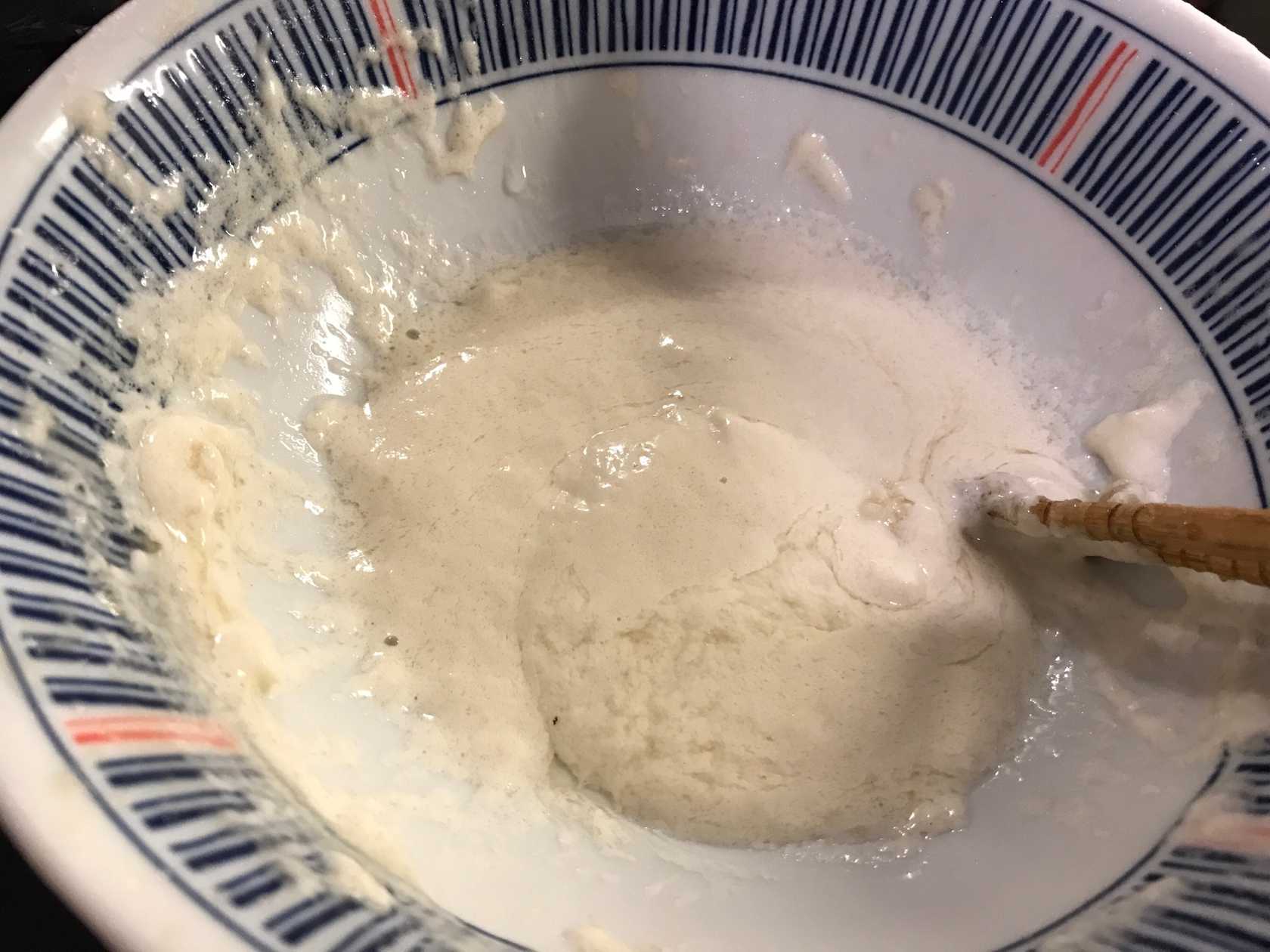 Mixture of flour, oil, and water in a bowl